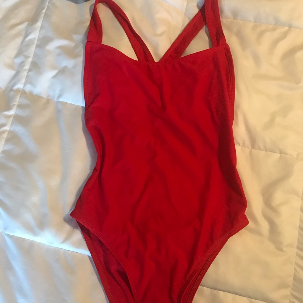 Red strappy one piece bathing suit